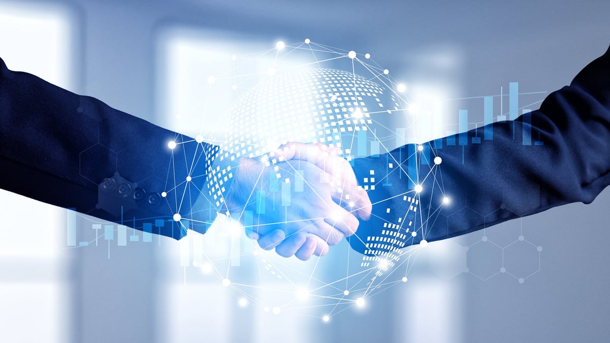 Apretón de manos empresarial frente a una red global de conexiones internacionales
